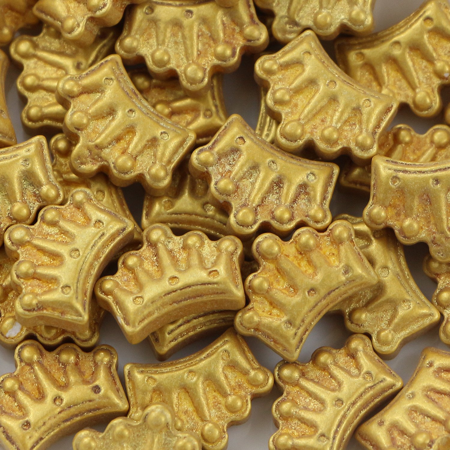 Gold metallic crown-shaped press candy with embossed detail for princess themes and birthday collections