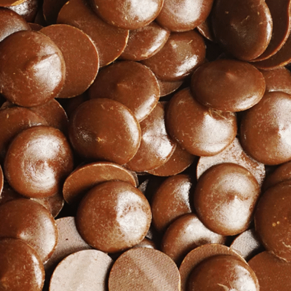 Close-up of glossy compound chocolate buttons for melting