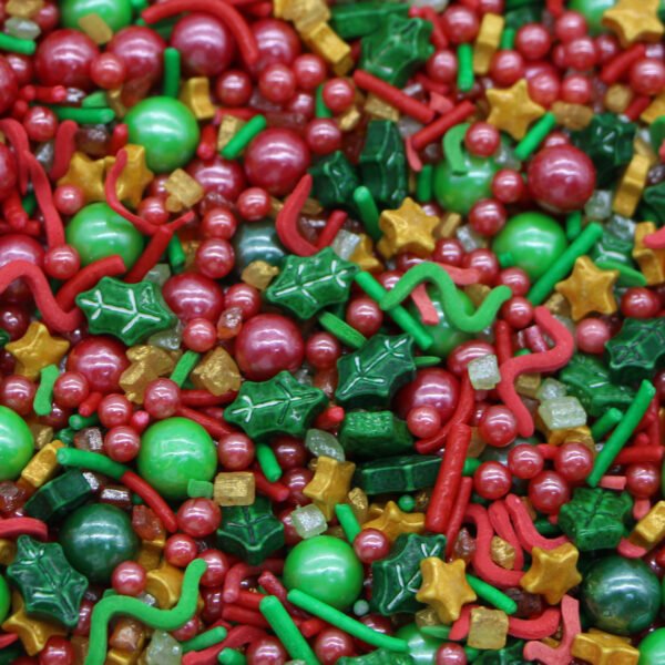 Christmas holiday sprinkle mix with red and green pearls, holly leaves and gold stars