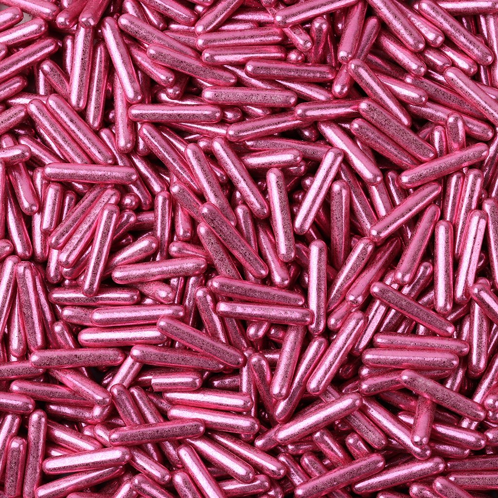 Metallic rose pink sugar rods with high-shine reflective finish for wedding cakes and celebration desserts