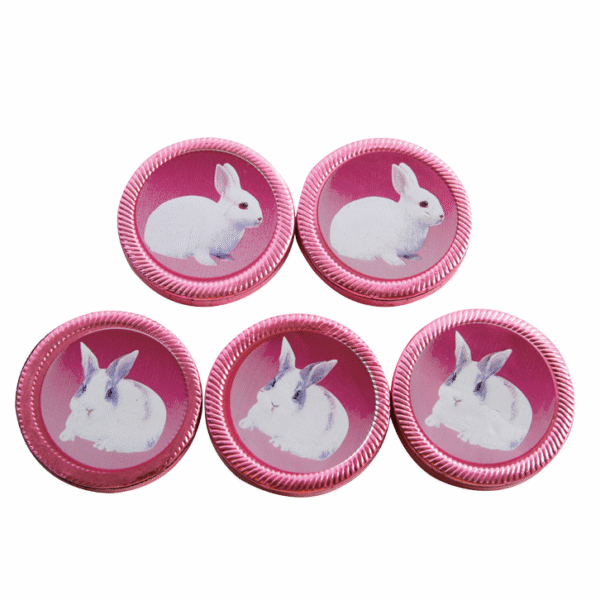 Pink foil chocolate medallions printed with a white Easter bunny
