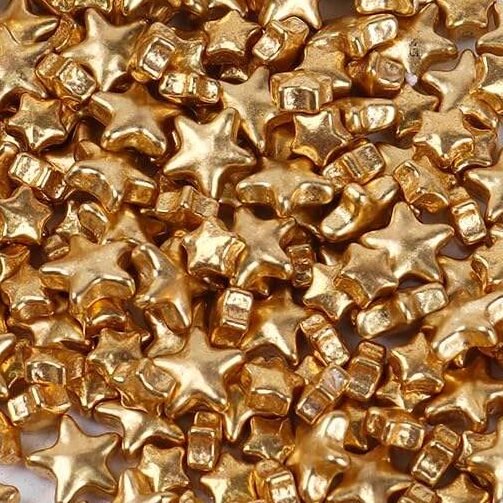 Gold metallic star-shaped sprinkles, shaped candy with metallic finish