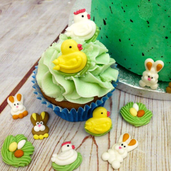 3D royal icing chick, hen and bunny toppers on a buttercream cupcake