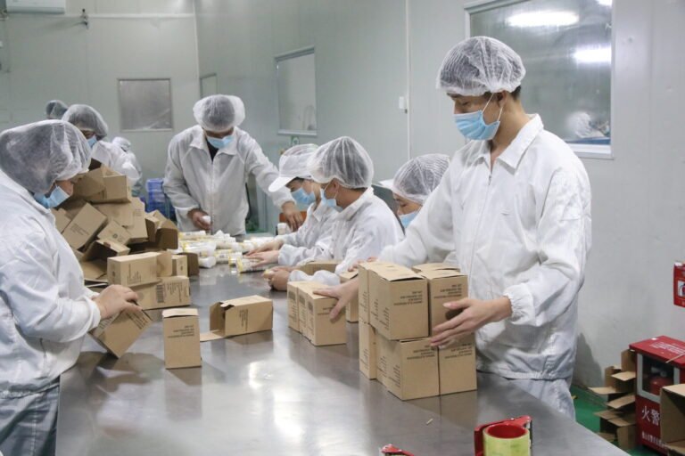 Bakerydeco packing team assembling private-label retail boxes