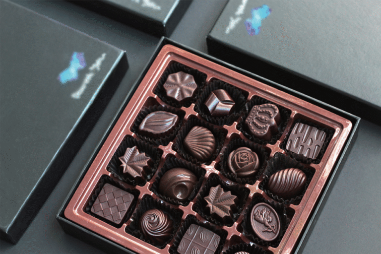 Assorted chocolates in a rose-gold gift box