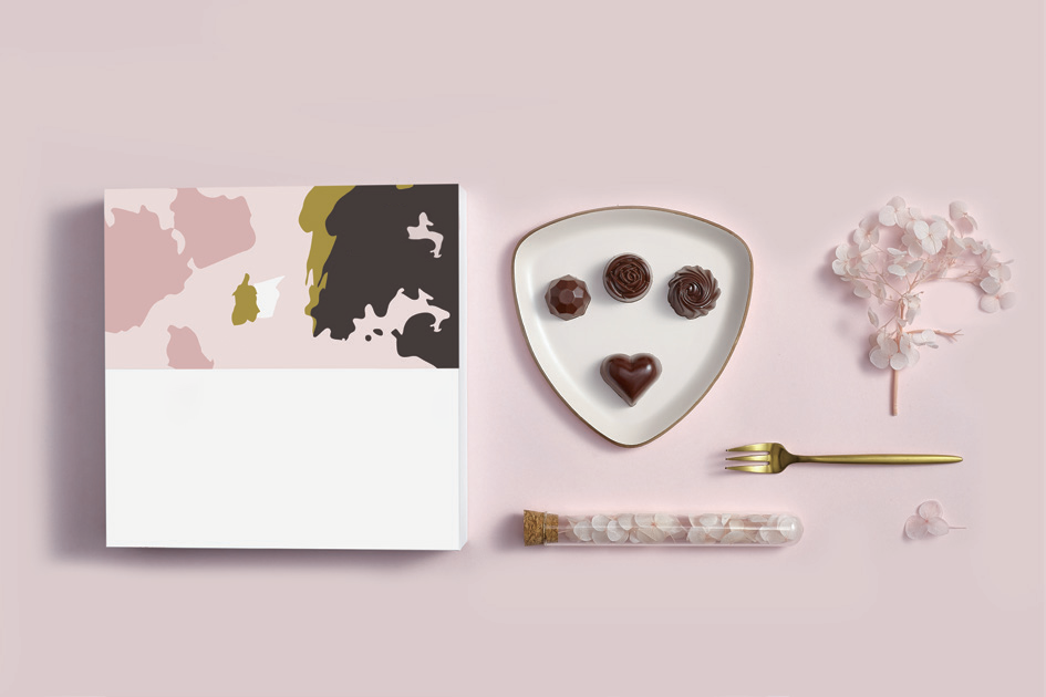 Pastel gift boxes with chocolate truffles and decorations