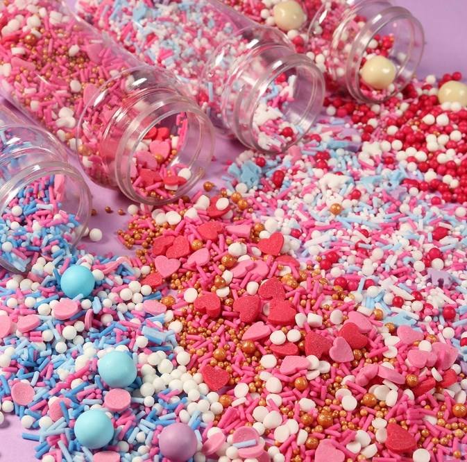 Holiday sprinkle mixes in clear retail jars