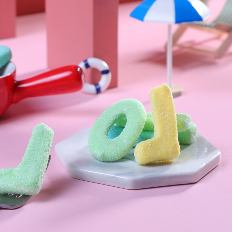 Letter-shaped gummies styled for e-commerce product photography