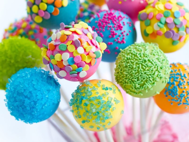 Assortment of brightly colored cake pops